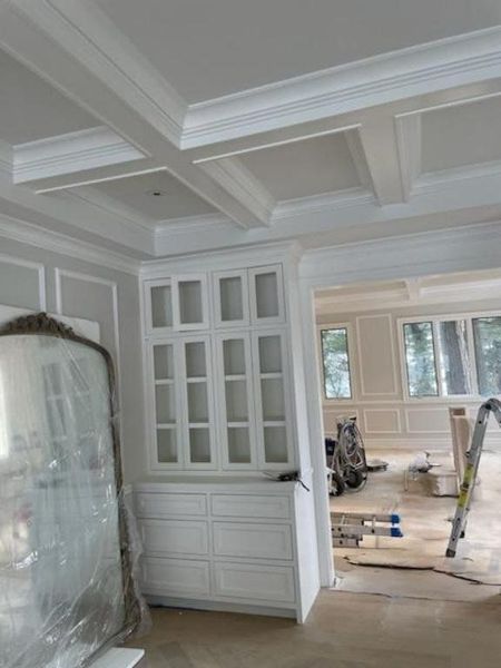 Built-in cabinets under a coffered ceiling
