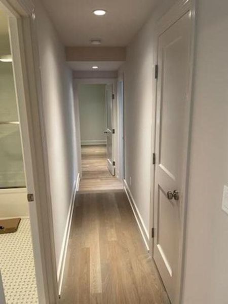 Hallway with painted doors, casings and baseboards