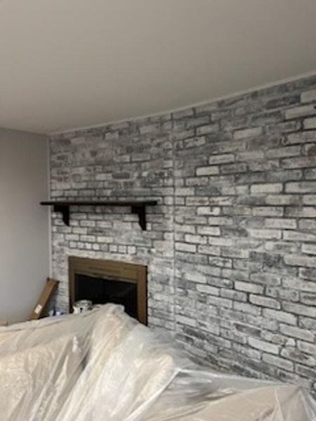Whitewashed brick fireplace feature wall